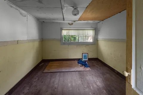 a view of porch with wooden floor