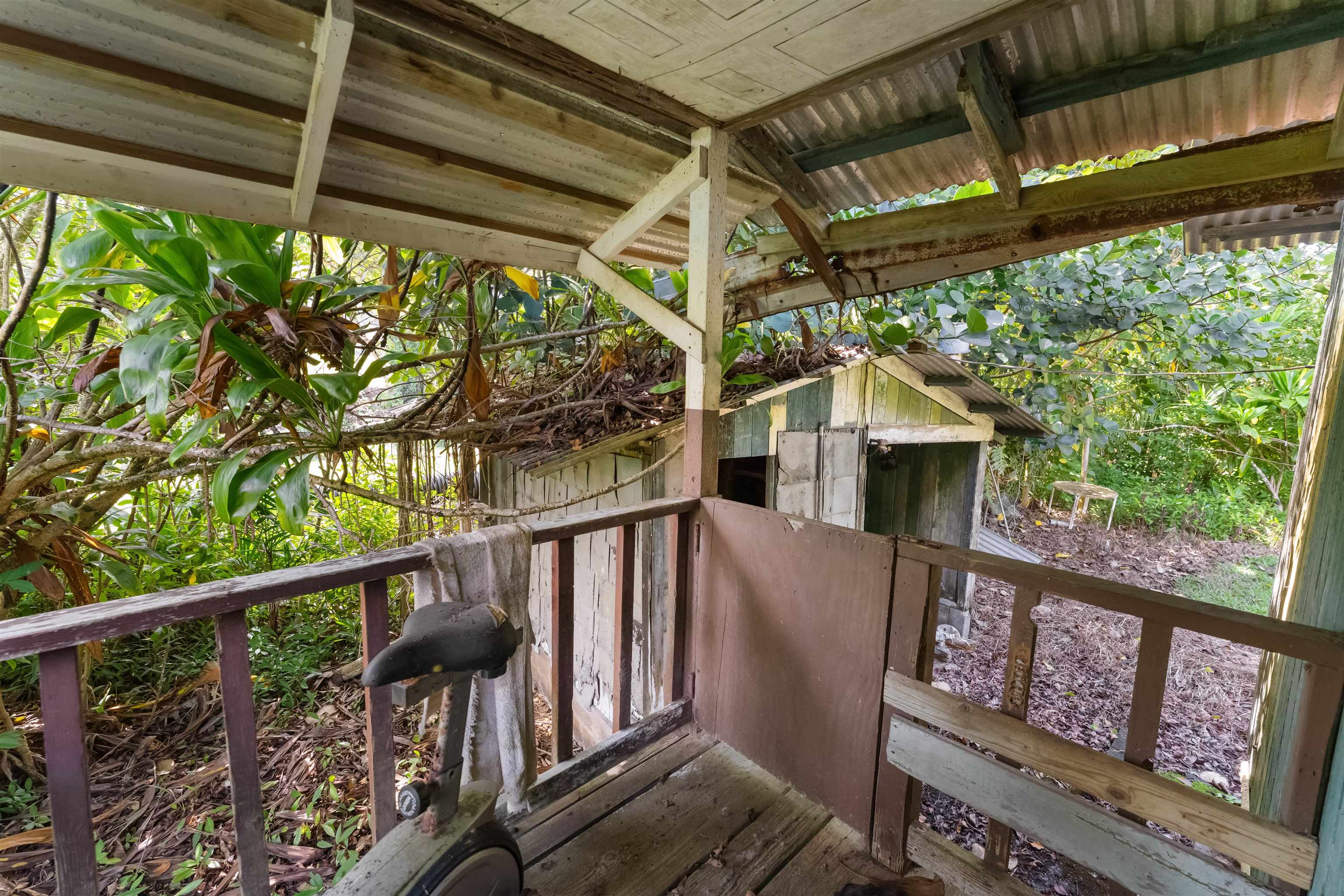 262 Wailua Road Haiku, HI 96708 - Photo 17 of 38 a view of porch with wooden floor