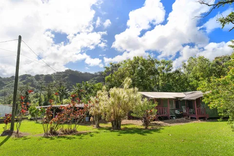 a view of a house with a yard porch and sitting area