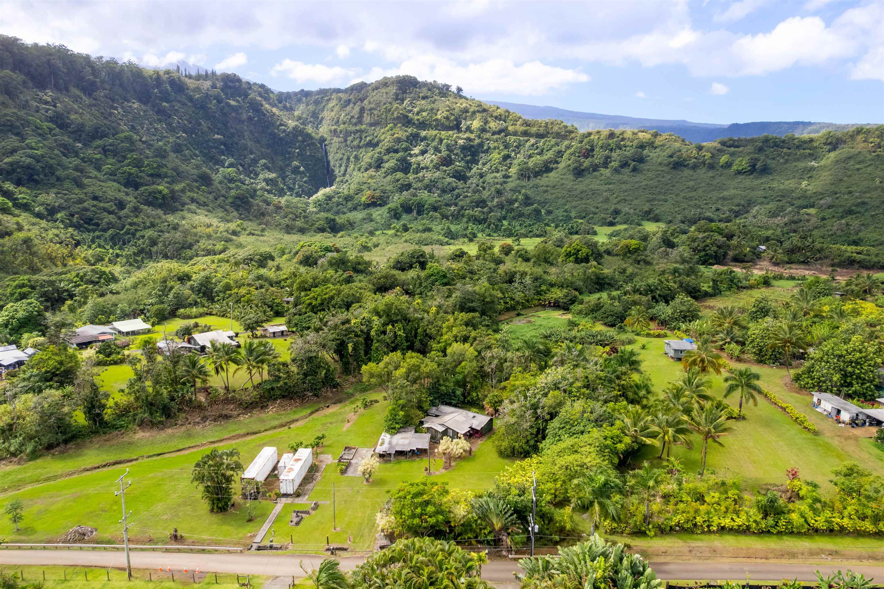 262 Wailua Road Haiku, HI 96708 - Photo 32 of 38 a view of a city with mountains in the background