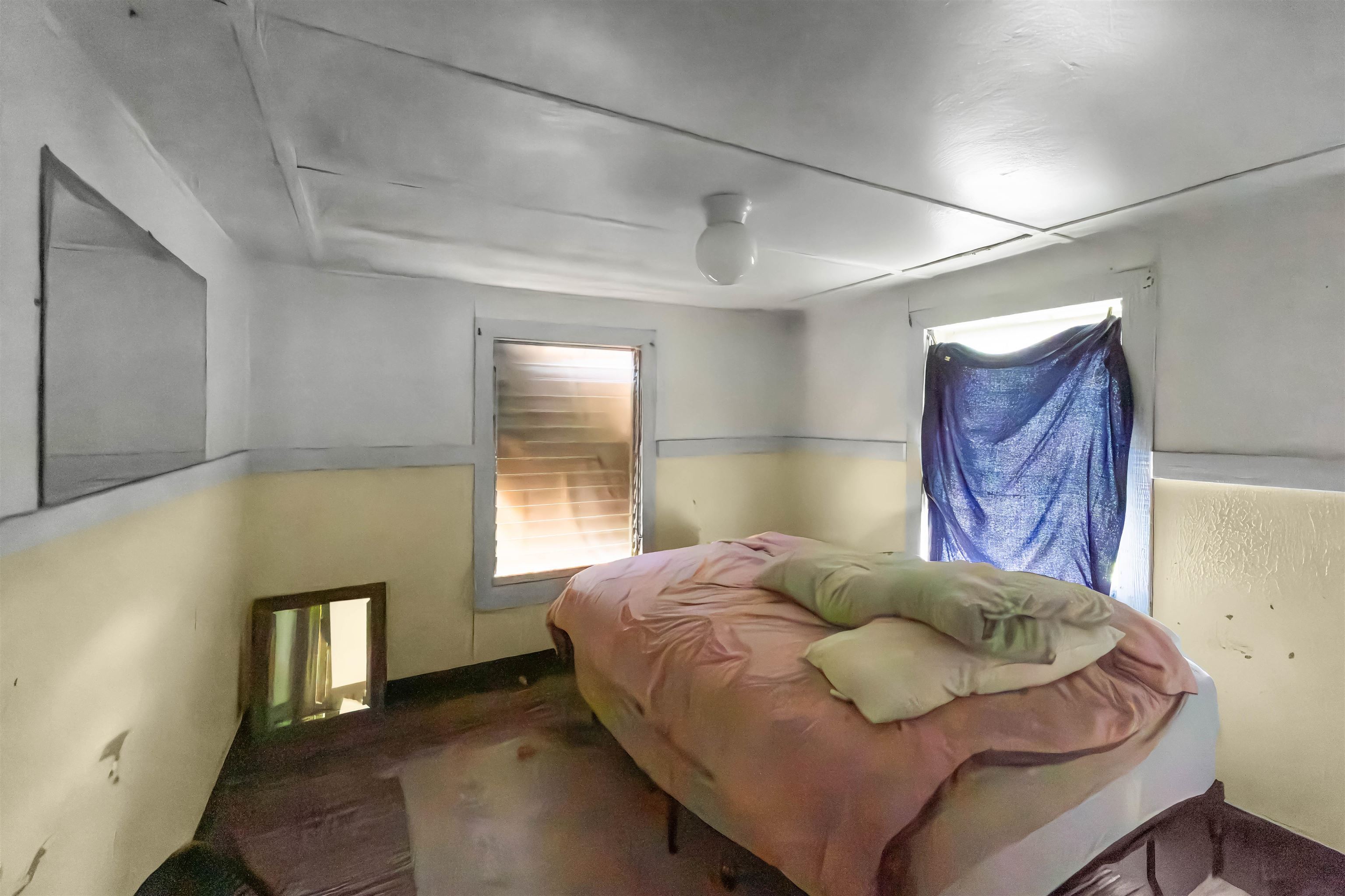 262 Wailua Road Haiku, HI 96708 - Photo 10 of 38 a bedroom with a bed and window