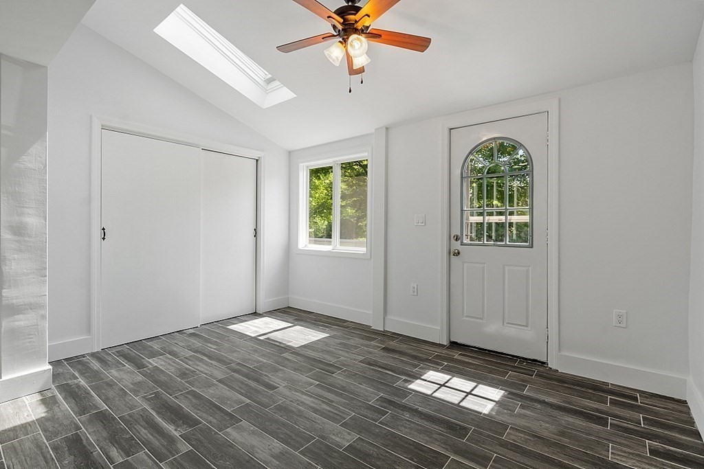 197 Beaman Road Sterling, MA 01564 - Photo 12 of 39 wooden floor in an empty room with a window