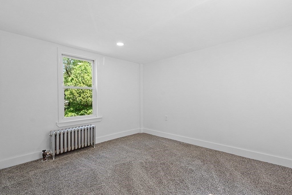 197 Beaman Road Sterling, MA 01564 - Photo 13 of 39 an empty room with windows