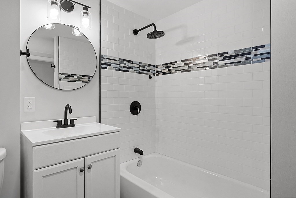 197 Beaman Road Sterling, MA 01564 - Photo 14 of 39 a bathroom with a sink a mirror a vanity and shower