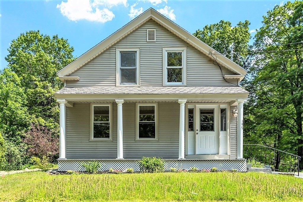 197 Beaman Road Sterling, MA 01564 - Photo 2 of 39 a front view of a house with a yard