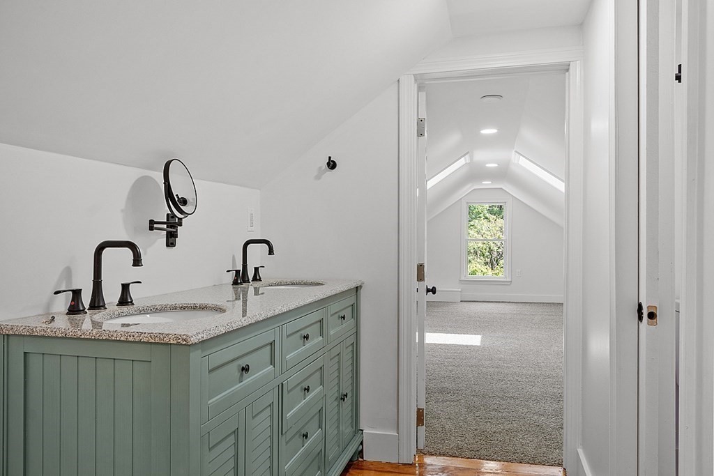 197 Beaman Road Sterling, MA 01564 - Photo 26 of 39 a bathroom with a granite countertop sink and a mirror