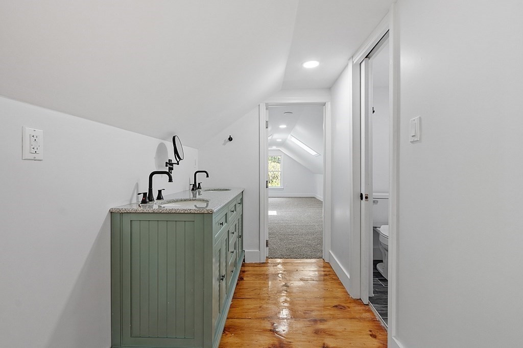 197 Beaman Road Sterling, MA 01564 - Photo 27 of 39 a bathroom with a sink and mirror