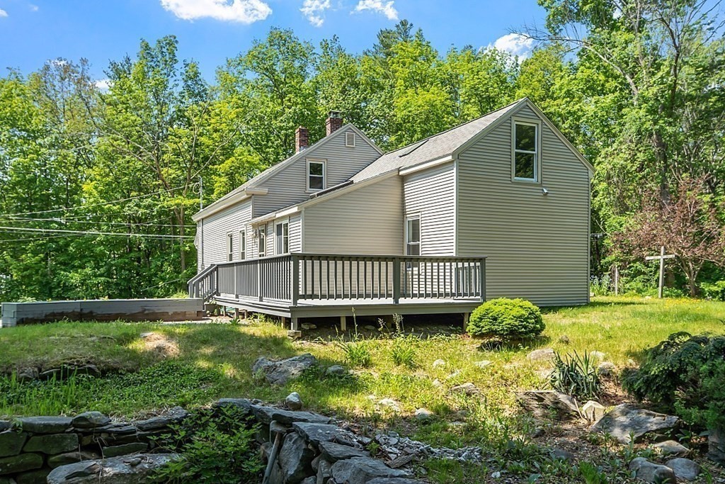 197 Beaman Road Sterling, MA 01564 - Photo 3 of 39 a view of a house with a yard and sitting area