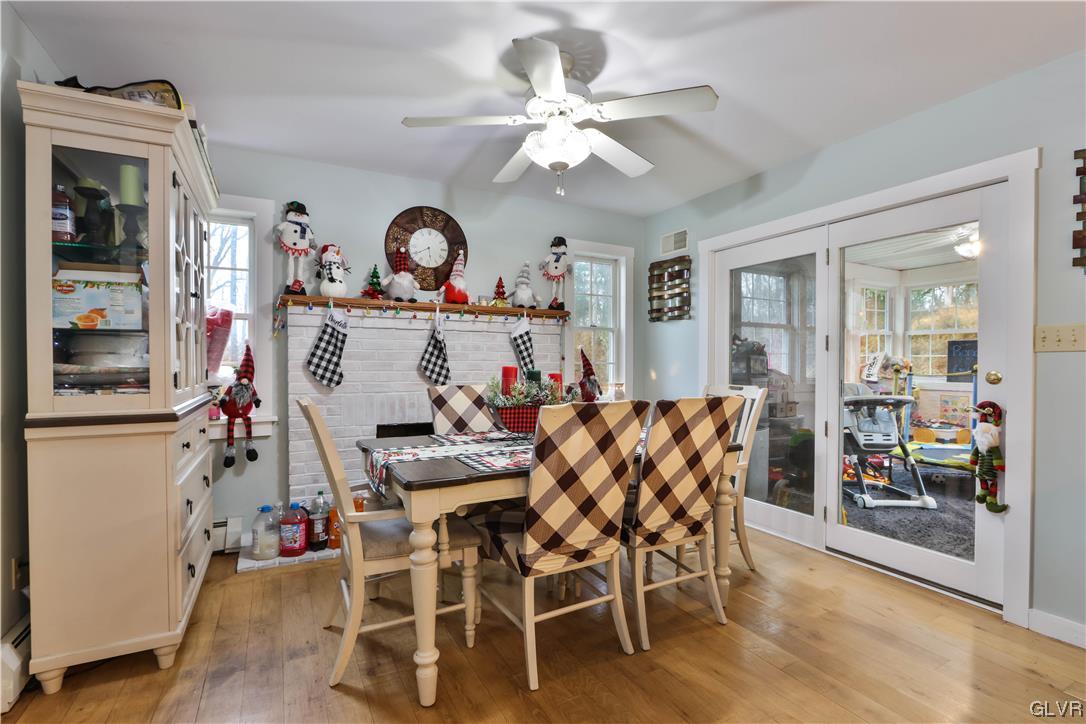 5873 Cherry Valley Road Stroudsburg, PA 18360 - Photo 12 of 36 a view of a dining room with furniture and wooden floor