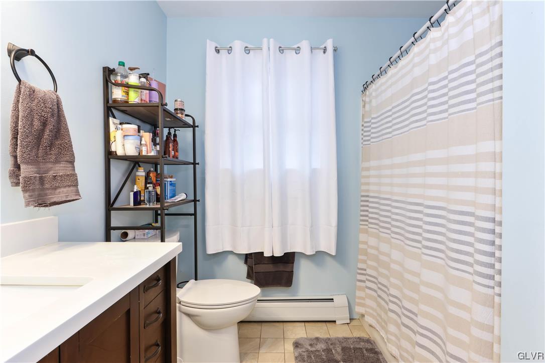 5873 Cherry Valley Road Stroudsburg, PA 18360 - Photo 28 of 36 a bathroom with a sink a toilet and a shower curtain