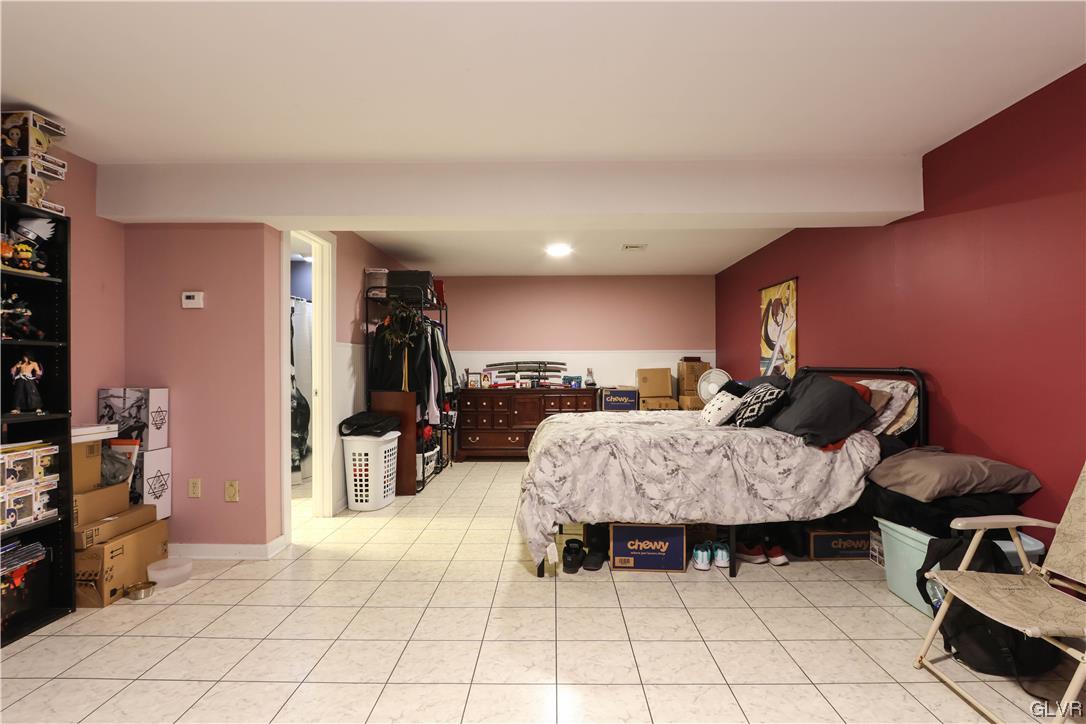 5873 Cherry Valley Road Stroudsburg, PA 18360 - Photo 29 of 36 a living room with furniture and a flat screen tv