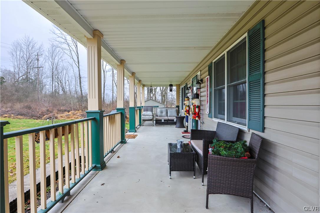 5873 Cherry Valley Road Stroudsburg, PA 18360 - Photo 5 of 36 a view of a porch with furniture