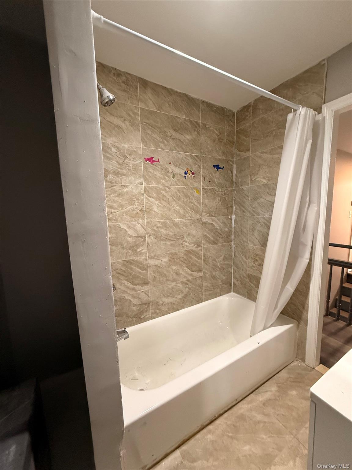 a bathroom with a shower and a tub