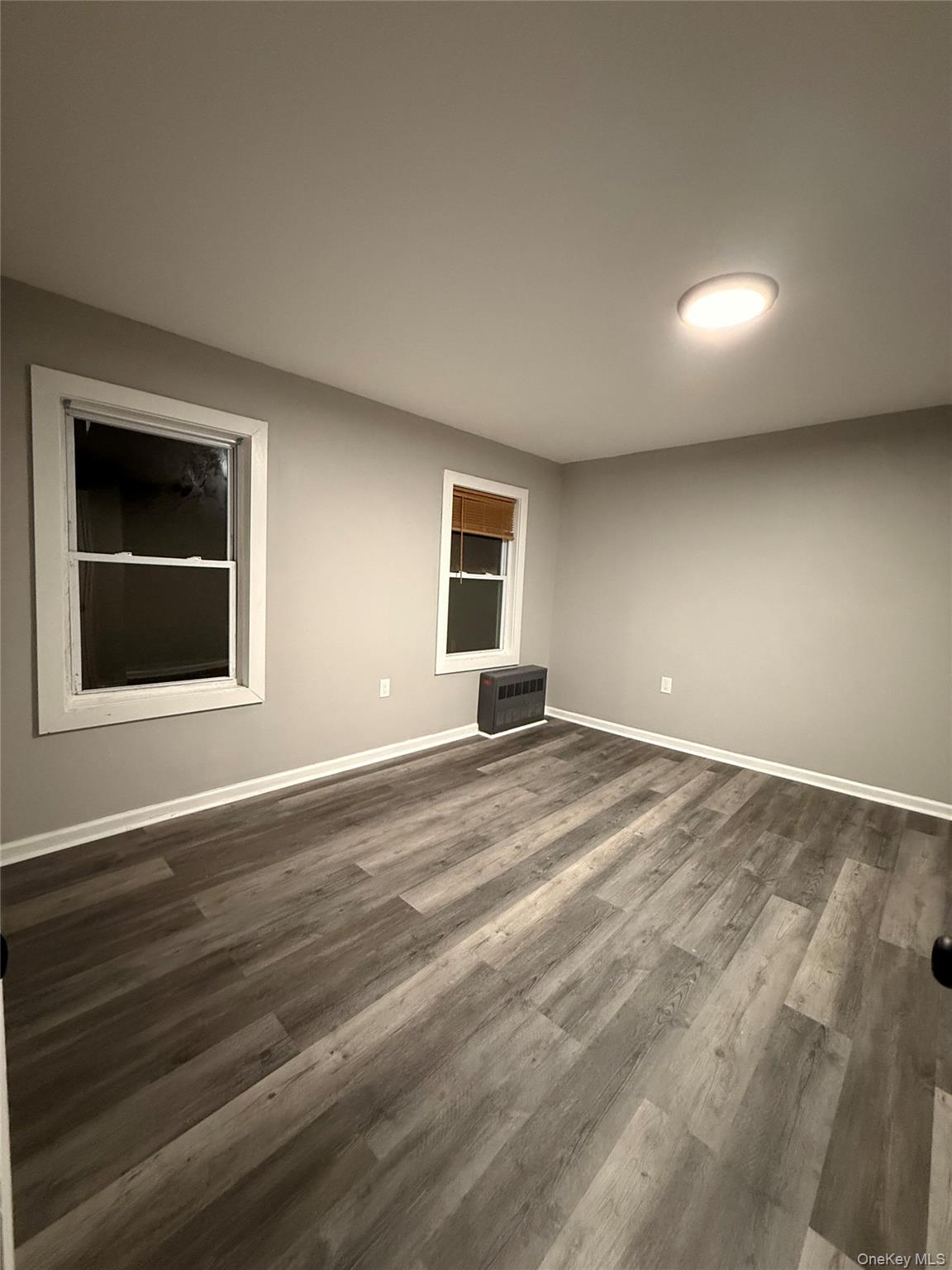 7 Grant Street, Unit 2 Poughkeepsie, NY 12601 - Photo 7 of 13 a view of empty room with wooden floor and fan