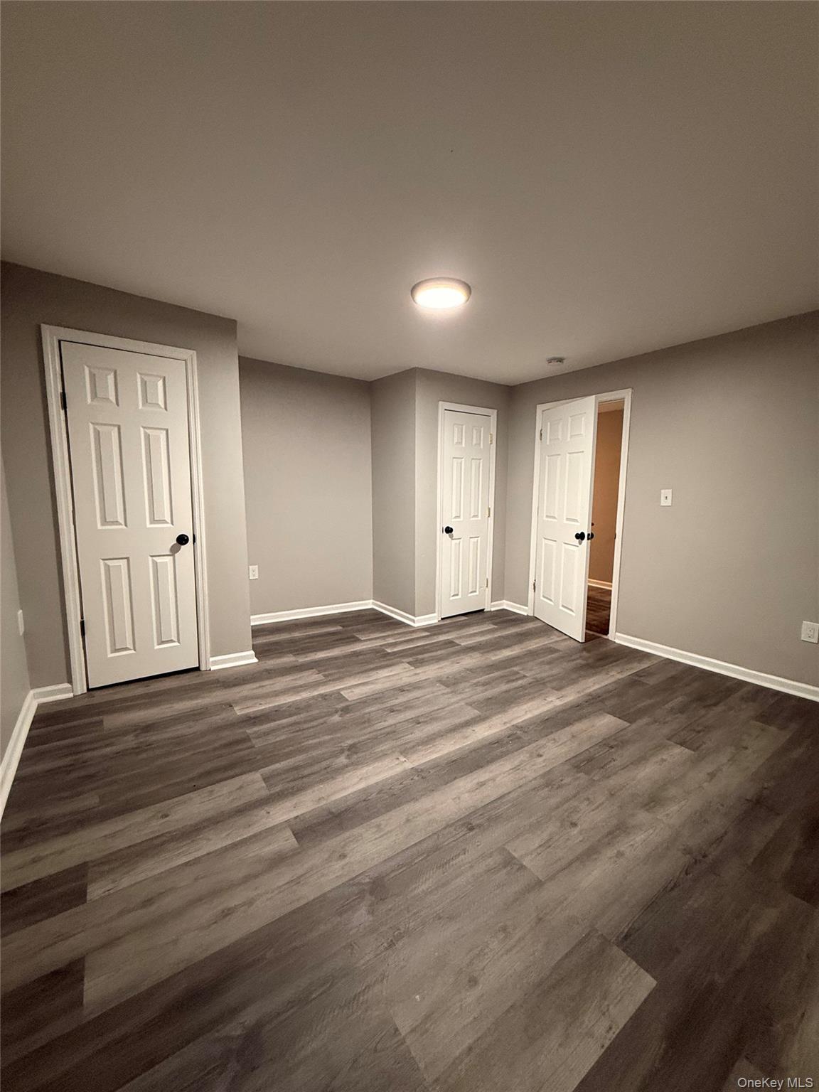 7 Grant Street, Unit 2 Poughkeepsie, NY 12601 - Photo 10 of 13 a view of empty room with wooden floor