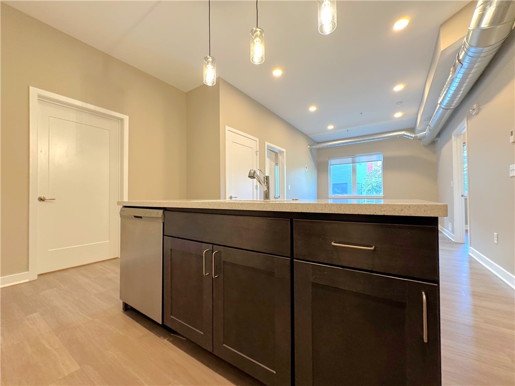 625 South Goodman Street, Unit 111 Rochester, NY 14620 - Photo 4 of 21 Another view of kitchen with kitchen island cabine