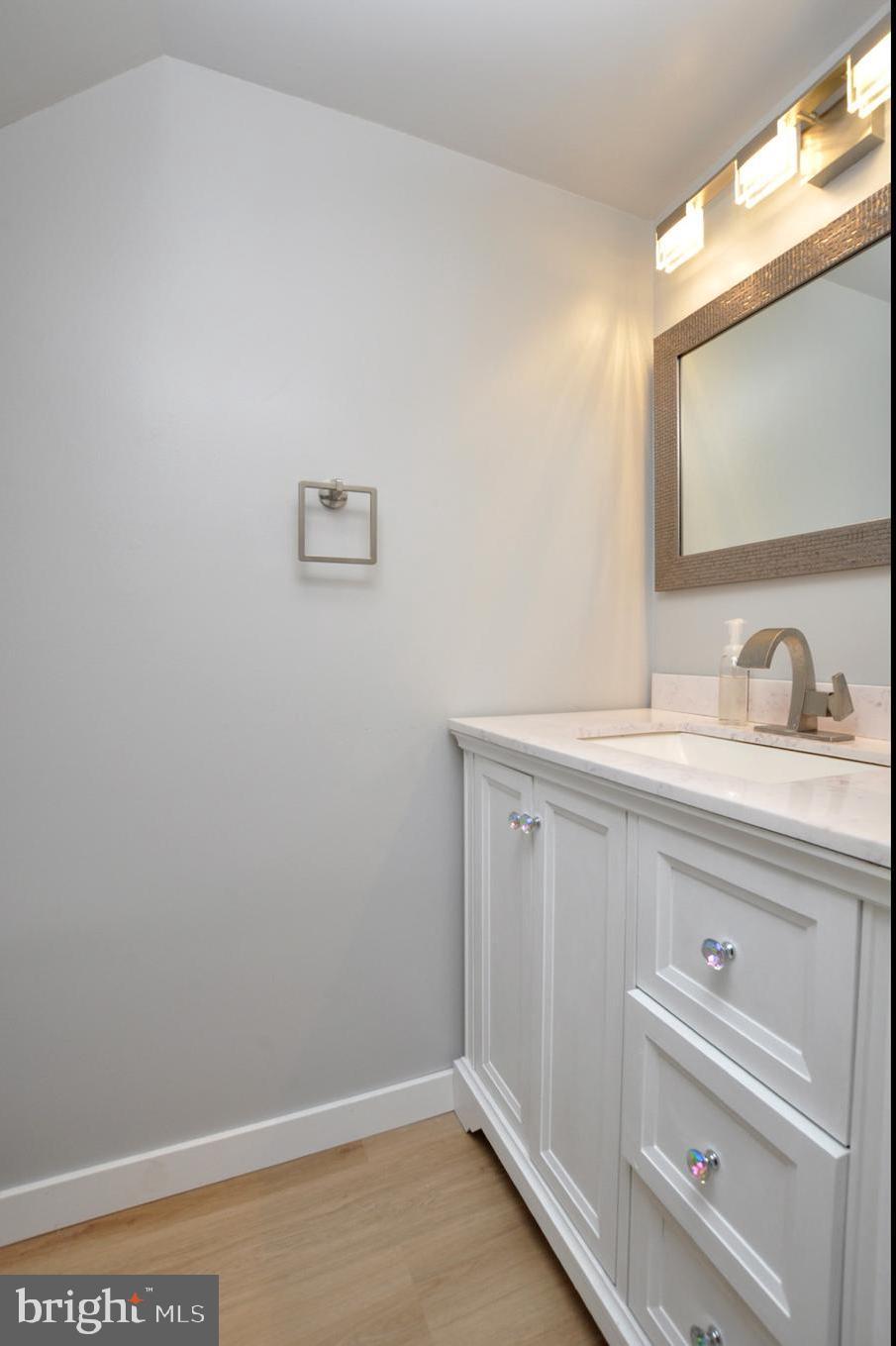 45 Sherri Way Pine Hill, NJ 08021 - Photo 13 of 31 a bathroom with a sink and a mirror