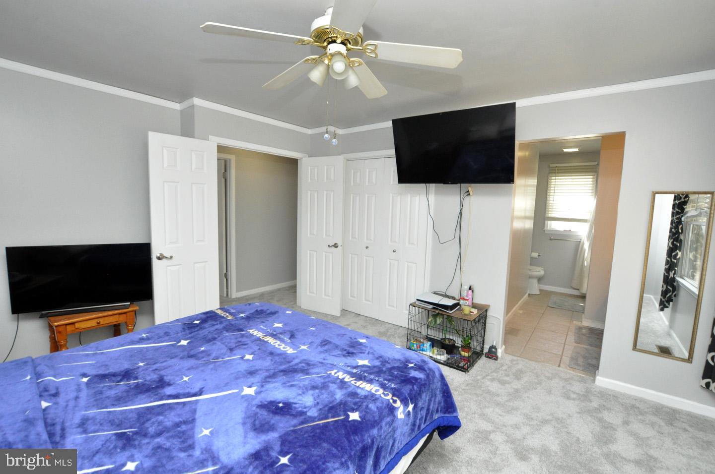 45 Sherri Way Pine Hill, NJ 08021 - Photo 15 of 31 a bedroom with a bed and a flat screen tv