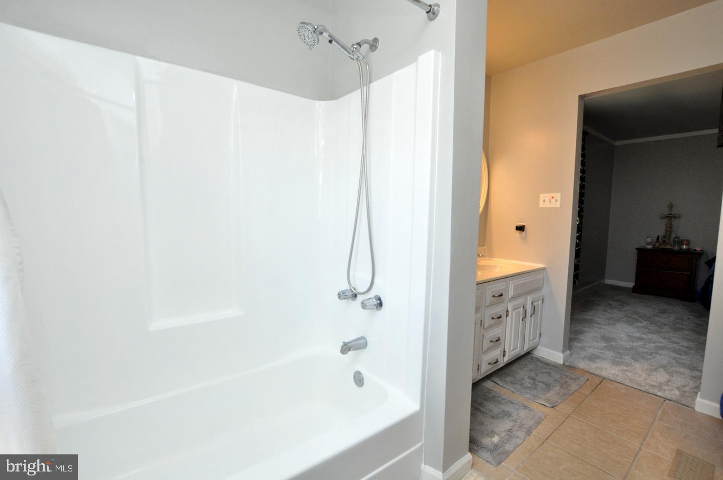 45 Sherri Way Pine Hill, NJ 08021 - Photo 16 of 31 a bathroom with a bathtub and a shower