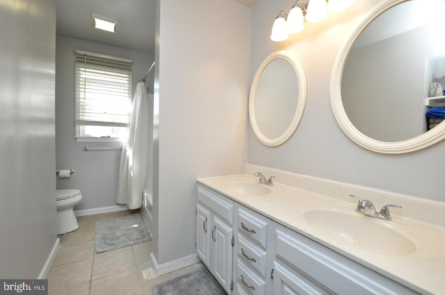 45 Sherri Way Pine Hill, NJ 08021 - Photo 17 of 31 a spacious bathroom with a double vanity sink toilet and a mirror