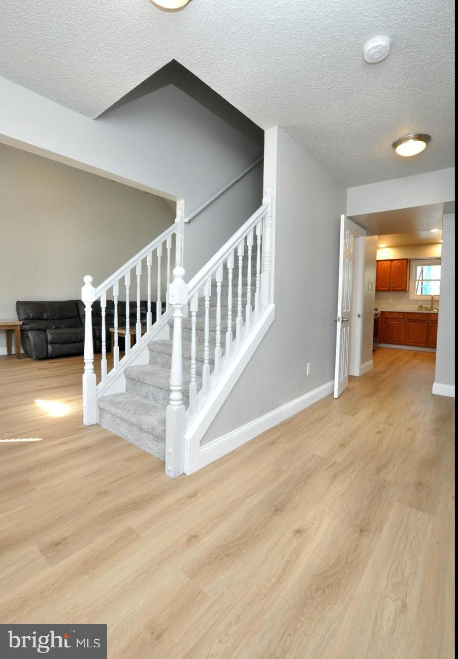 45 Sherri Way Pine Hill, NJ 08021 - Photo 2 of 31 a view of a hallway with wooden floor and entryway