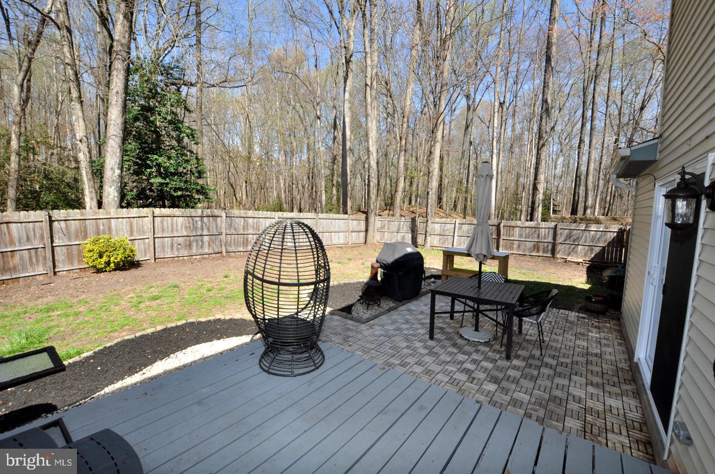 45 Sherri Way Pine Hill, NJ 08021 - Photo 25 of 31 a view of a deck with table and chairs with wooden floor and fence