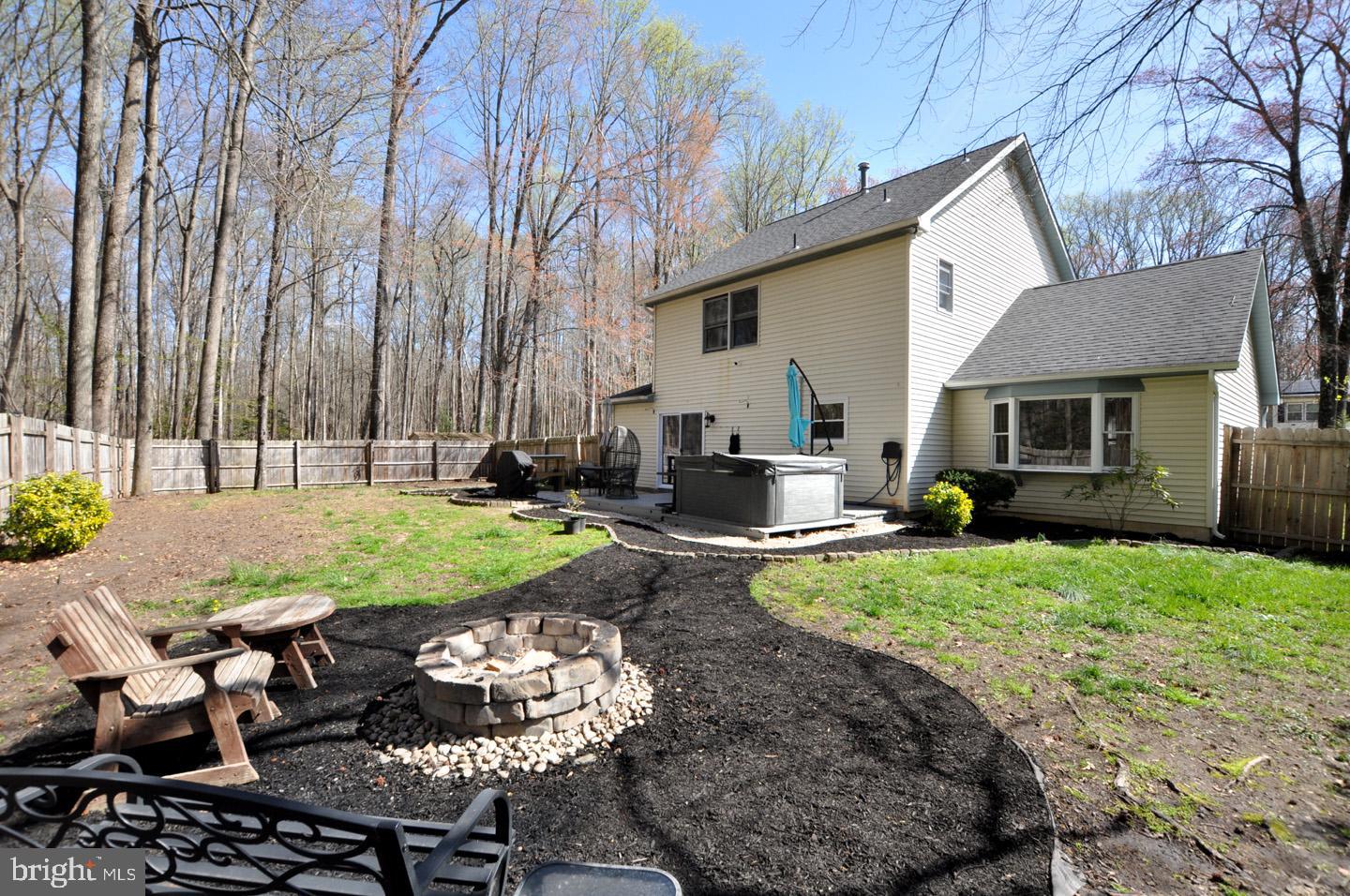 45 Sherri Way Pine Hill, NJ 08021 - Photo 27 of 31 a view of a backyard with table and chairs potted plants and large tree