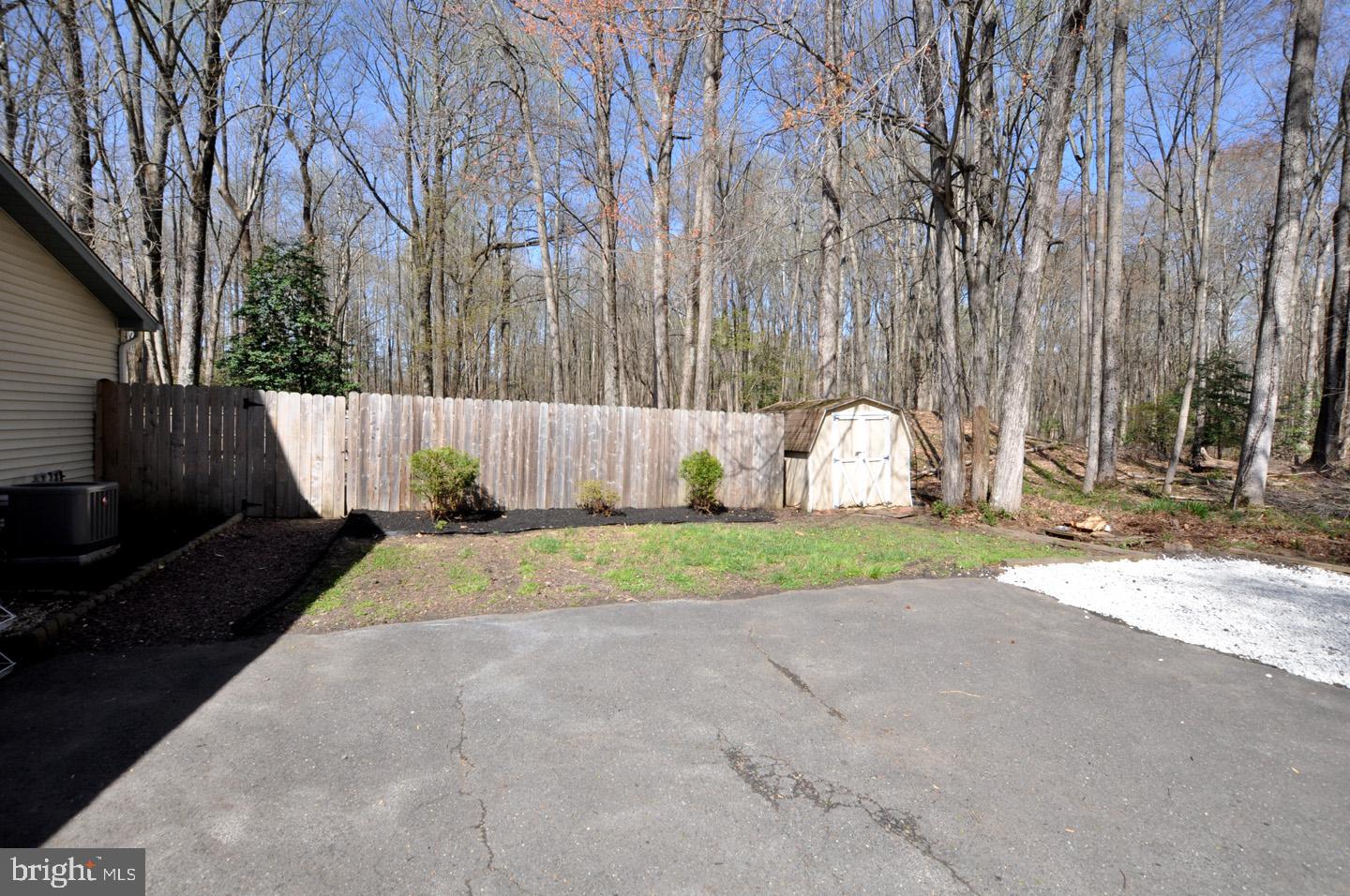 45 Sherri Way Pine Hill, NJ 08021 - Photo 30 of 31 a view of backyard with table and chairs and a large tree