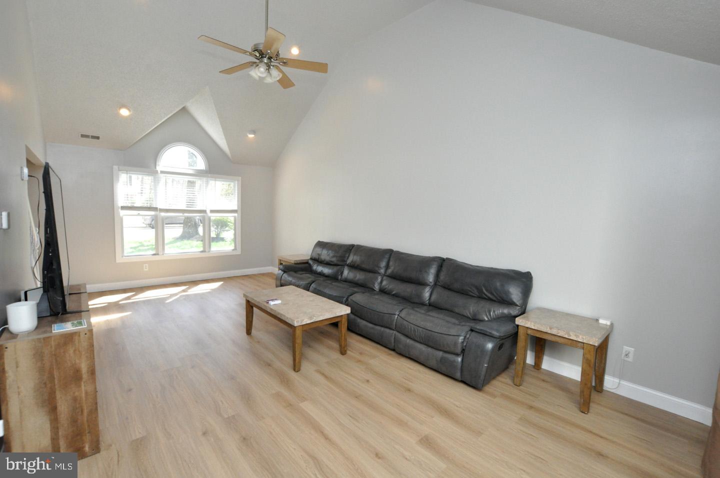 45 Sherri Way Pine Hill, NJ 08021 - Photo 6 of 31 a living room with furniture a fireplace and a flat screen tv