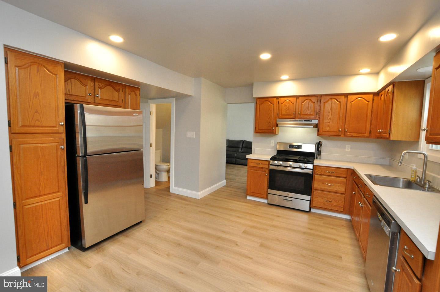 45 Sherri Way Pine Hill, NJ 08021 - Photo 8 of 31 a kitchen with stainless steel appliances granite countertop a refrigerator a sink and a stove