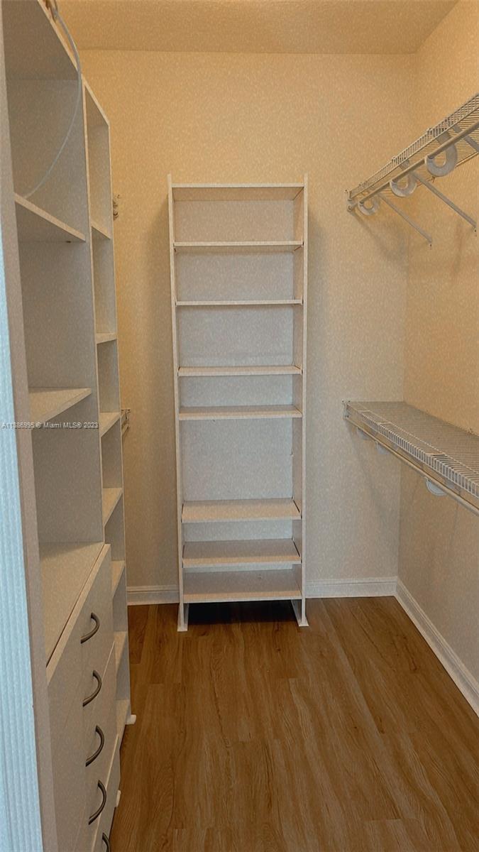 Windsor Palms Miramar, FL 33027 - Photo 17 of 30 a view of walk in closet with empty racks