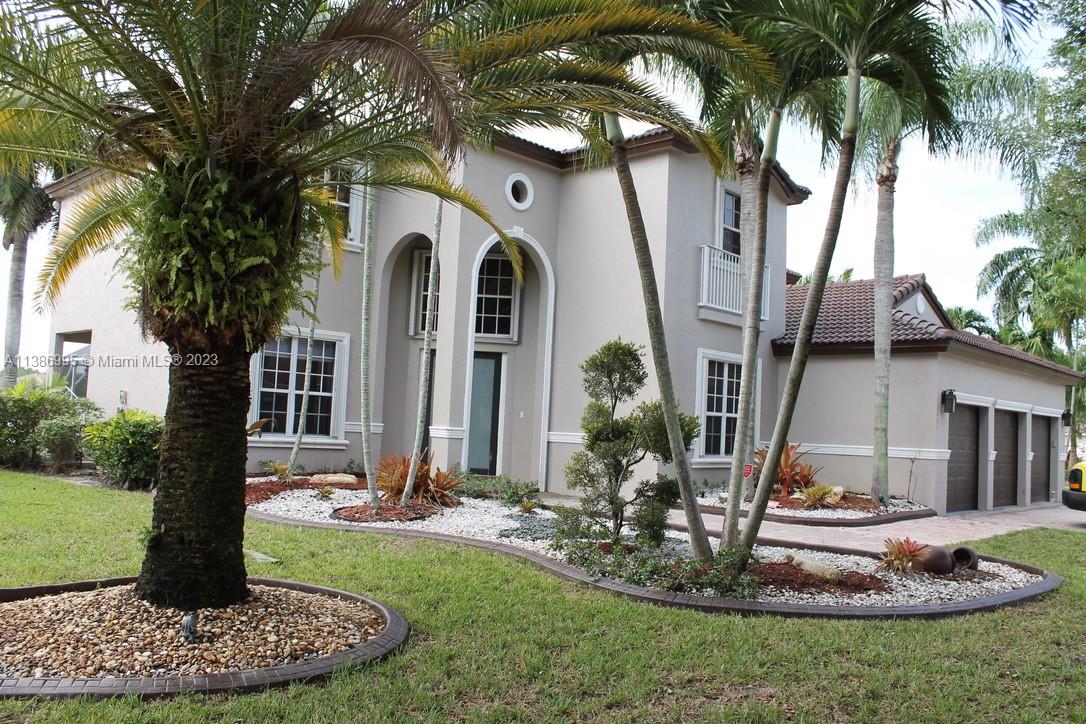 Windsor Palms Miramar, FL 33027 - Photo 2 of 30 a front view of a house with a yard