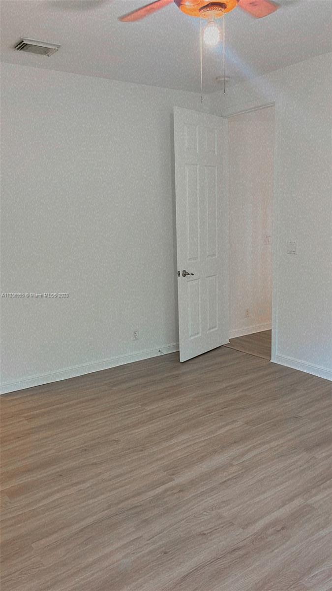 Windsor Palms Miramar, FL 33027 - Photo 23 of 30 a view of an empty room with wooden floor