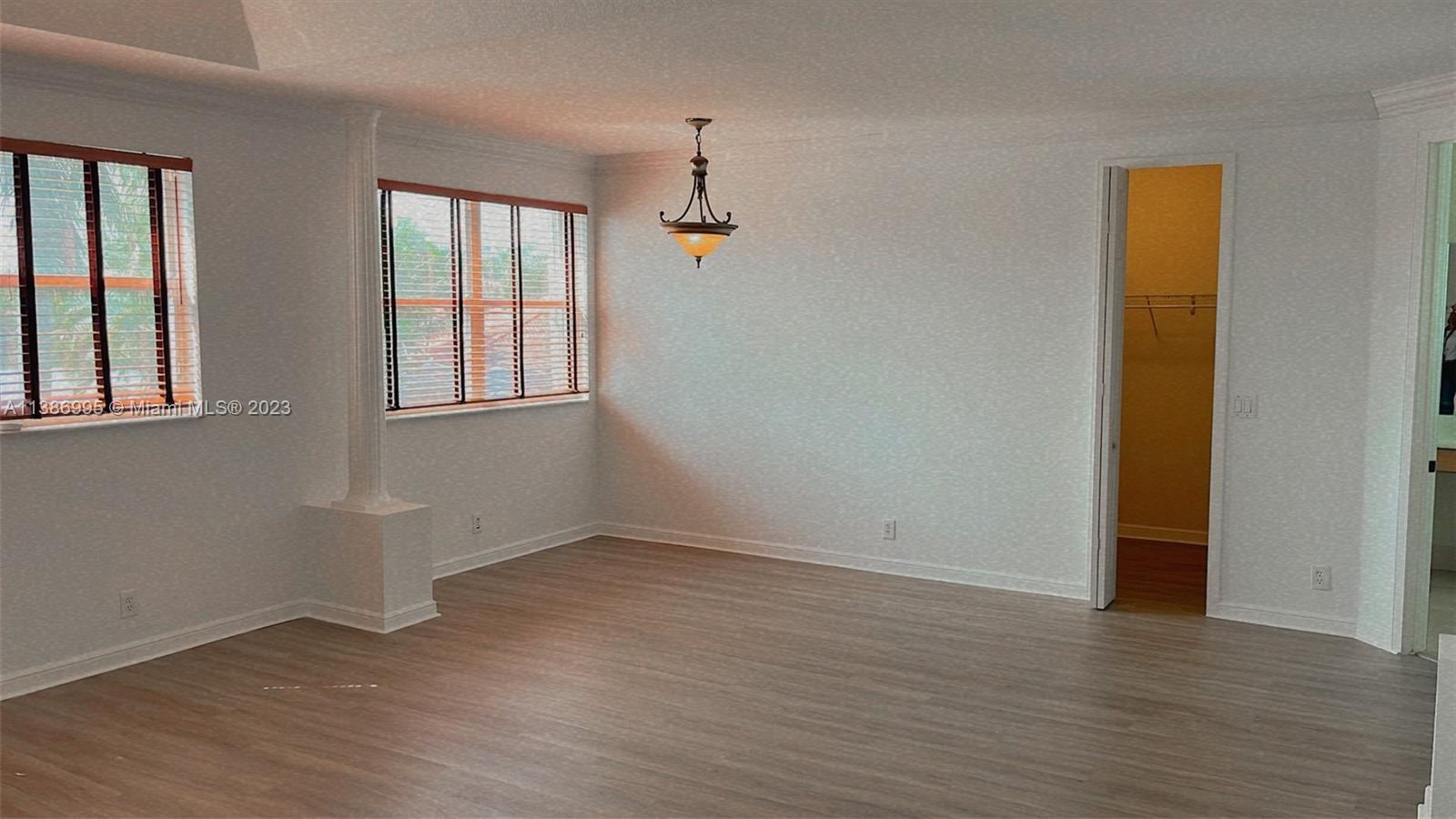 Windsor Palms Miramar, FL 33027 - Photo 24 of 30 an empty room with wooden floor and windows
