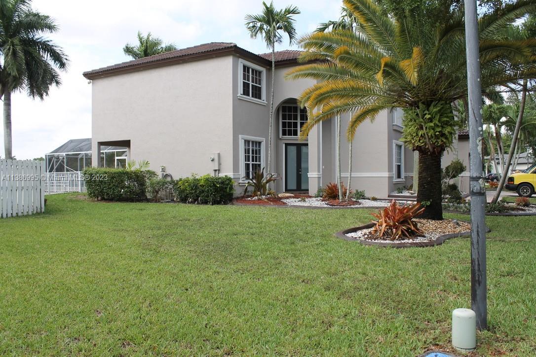 Windsor Palms Miramar, FL 33027 - Photo 3 of 30 a front view of a house with garden