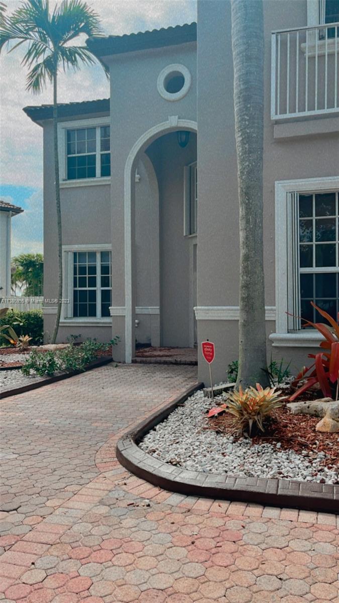 Windsor Palms Miramar, FL 33027 - Photo 4 of 30 a view of a house with a dry yard and potted plants