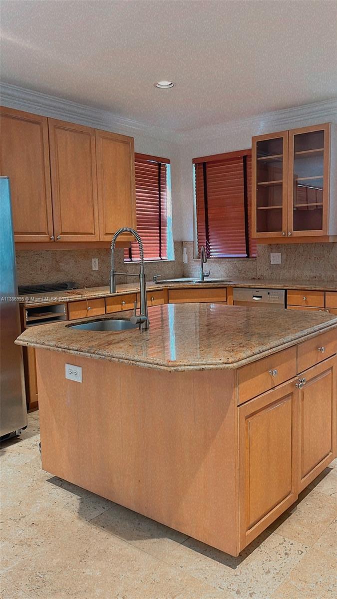 Windsor Palms Miramar, FL 33027 - Photo 8 of 30 a view of kitchen with stainless steel appliances granite countertop a stove a sink and dishwasher