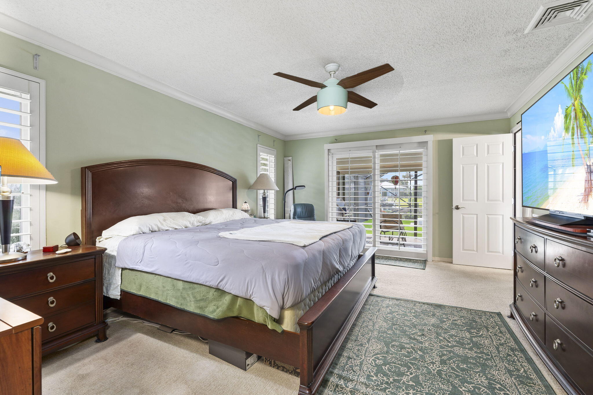 3374 Southeast Fairway East Stuart, FL 34997 - Photo 21 of 65 a bedroom with a bed and wooden floor