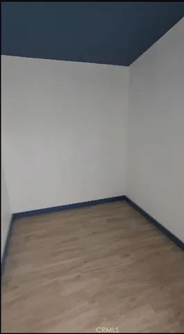 a kitchen with a cabinets and white appliances