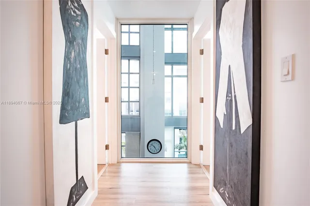 a view of entryway with bathroom and shower