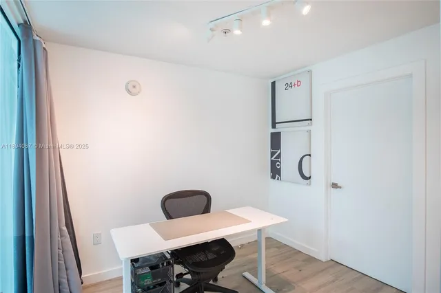 a workspace room with a table and chairs