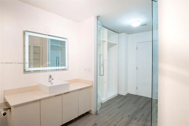 a bathroom with a sink and a mirror