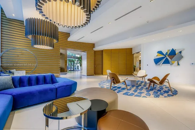 a living room with furniture wooden floor and a table