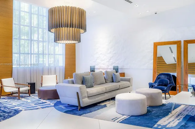 a living room with furniture and a lamp