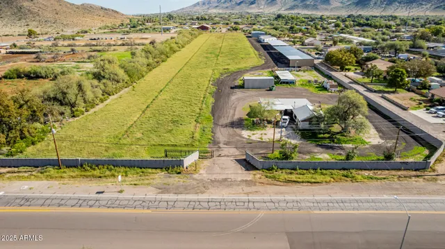 a view of a swimming pool with a lawn chairs