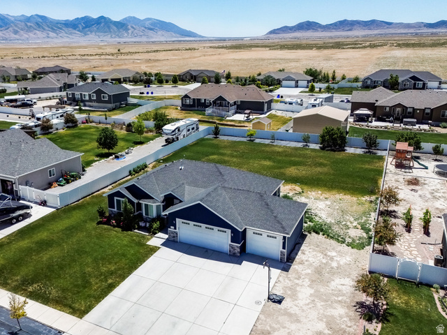 712 East Sunset View Road Grantsville, UT 84029 - Photo 2 of 44 Aerial perspective showing the gorgeous mountains in the backdrop