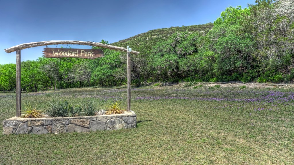560 Pine Mountain Road Camp Wood, TX 78833 - Photo 28 of 38 a view of a garden with a bench in the background