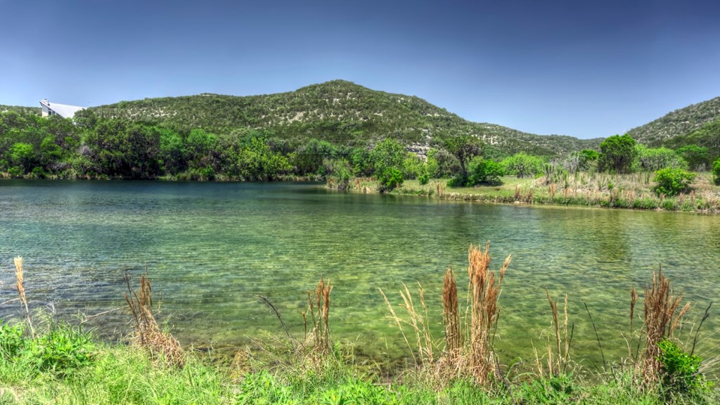 560 Pine Mountain Road Camp Wood, TX 78833 - Photo 29 of 38 a view of a lake with a mountain in the background