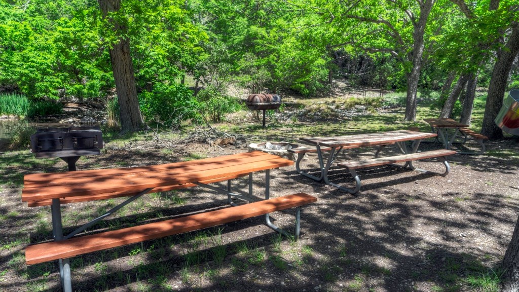 560 Pine Mountain Road Camp Wood, TX 78833 - Photo 38 of 38 a backyard of a house with yard and outdoor seating