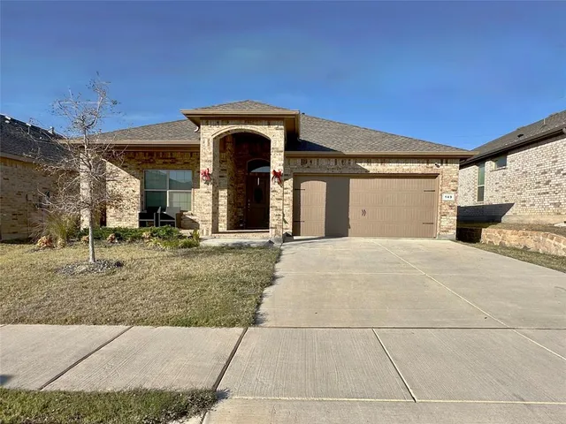 a view of a house with a garage
